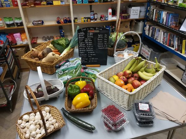 fruit, vegetables and other products on a table in the village shop